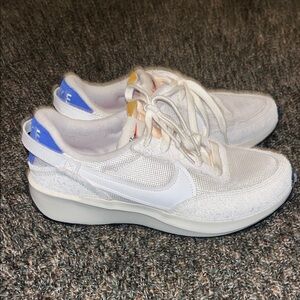 Nike Waffle Debut Vintage shoes in white with accents.